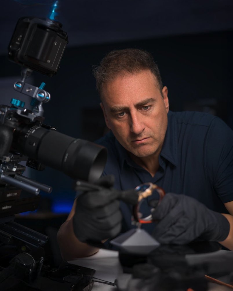 Figueroa, jewelry and watch photographer, at work with a macro camera rig in the Miami studio